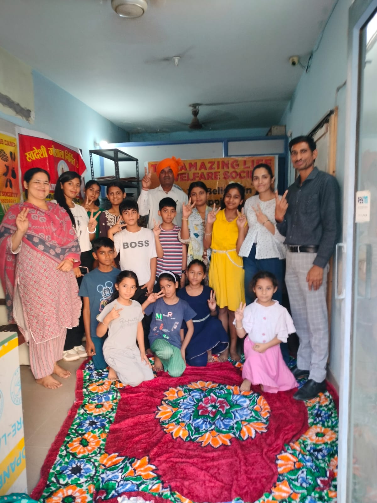 Children posing together indoors after a session
