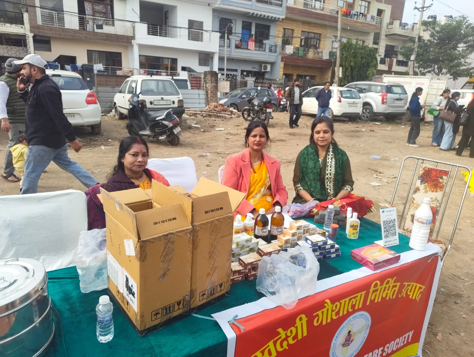 Volunteers running a Swadeshi products stall at a community fair