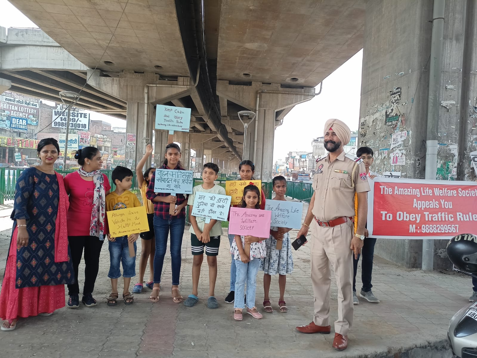 Volunteers and a traffic police officer during a road-safety rally